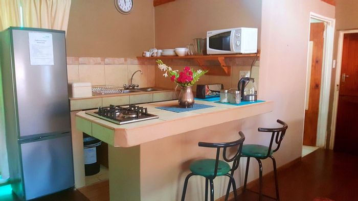 For Sale: House in Sabie Central with 9 bedrooms, self-catering units, and braai areas.