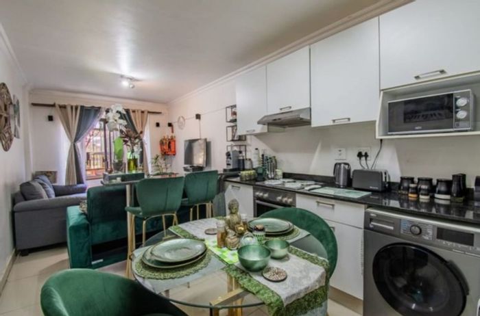 For Sale: Ground Floor Apartment in Umhlanga Central with Private Garden and Security.