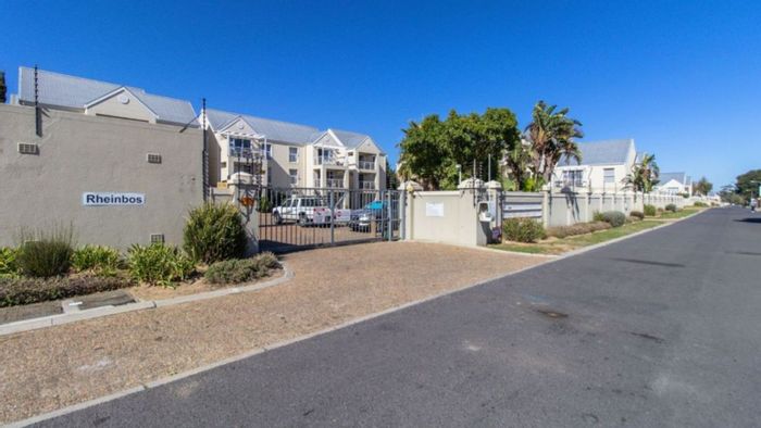 Spacious 3-bedroom apartment in Strand Central, close to beach and amenities. For Sale.