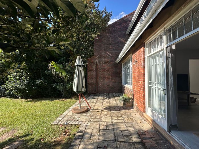Townhouse To Rent in Ashlea Gardens with pool, garden, and communal spaces.