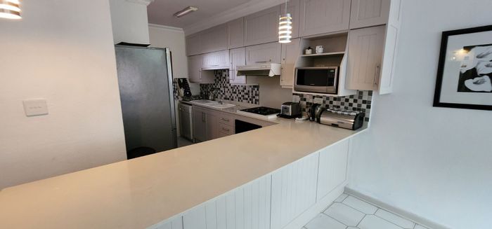 Waterfront House For Sale in Sunset Cove with pools, tennis courts, and boat access.