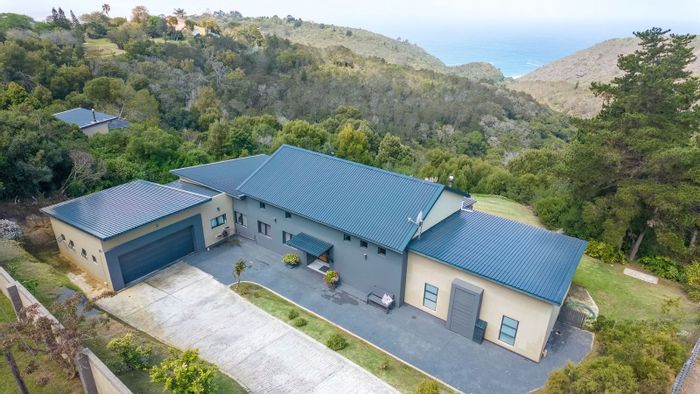 For Sale: House in Victoria Bay with ocean views, garden, and double garage.