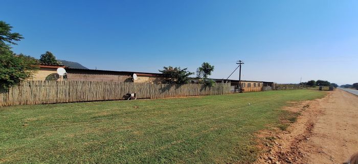 Koster Central Farm For Sale: 2-Hectare plot with high visibility and existing building.