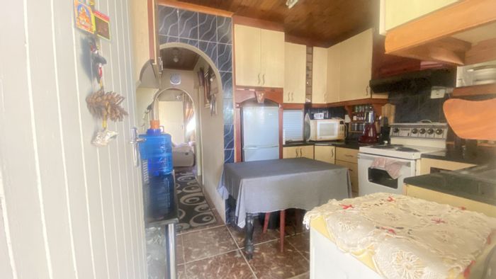 2-Bedroom House For Sale in Sunford with spacious yard and secure parking.
