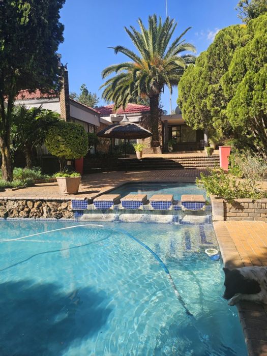 For Sale: Spacious Rispark house with multiple dwellings, pool, and squash court.