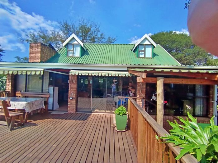 House for Sale in Sabie Ext 9: Waterfall views, spacious deck, low-maintenance garden.