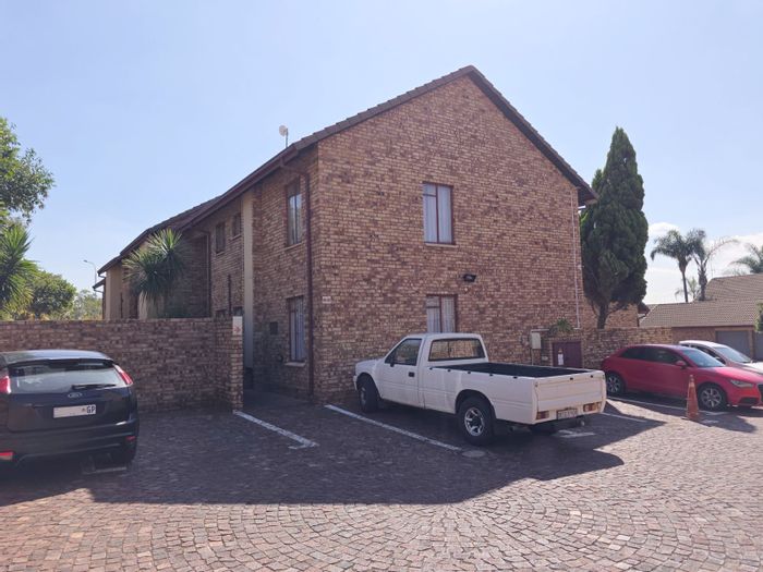 For Sale: Zwartkop Apartment with private garden, pool, and 24/7 security.
