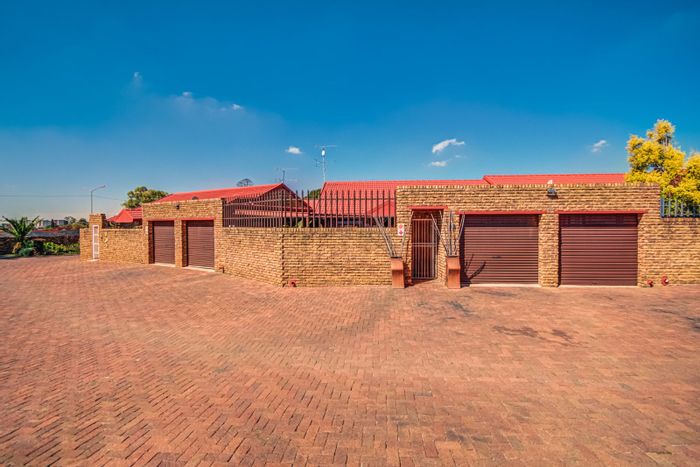 For Sale: Glen Marais Townhouse with 3 bedrooms, outdoor braai area, and double garage.