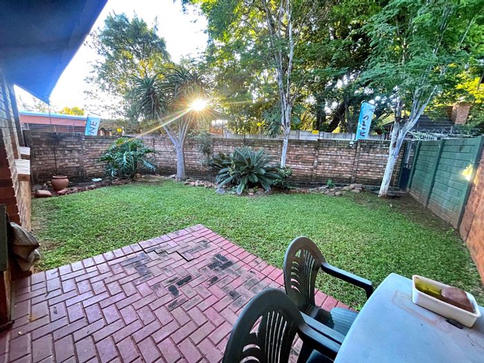 For Sale: 2-Bedroom Townhouse in Die Hoewes with garden, garage, and security.