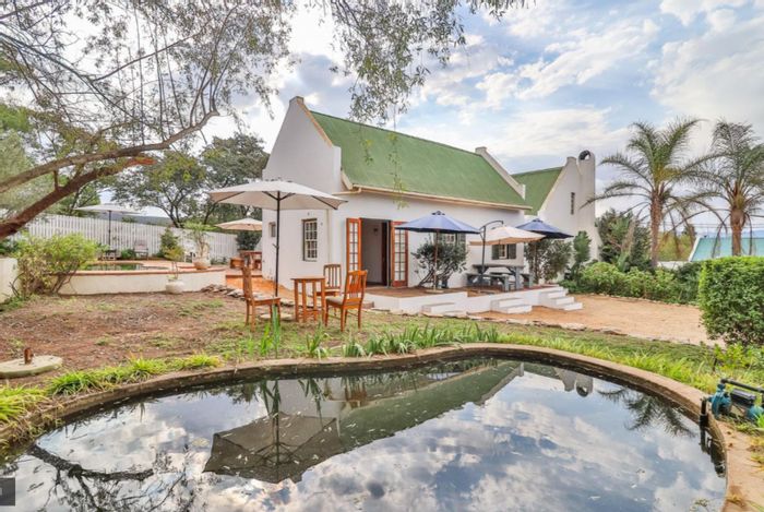 For Sale: House in McGregor Central with 4 guest units, pool, and gardens.