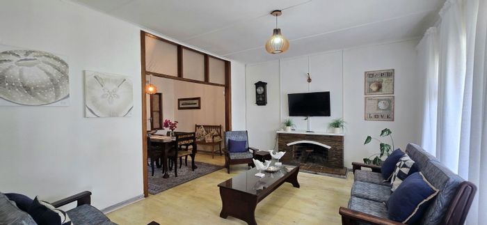 3-Bedroom House To Rent in Hartenbos Central with spacious yard and fireplace.