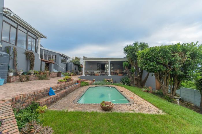 For Sale: House in Providentia with dual residences, ocean views, and entertainment spaces.