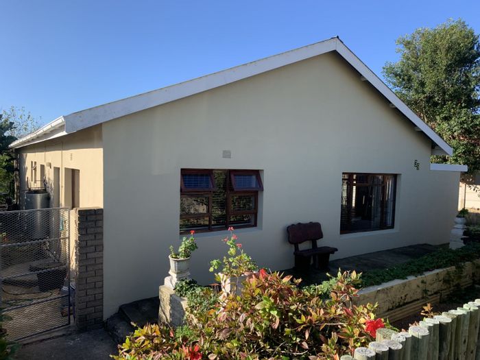 For Sale: House in Albertinia Central with 3 bedrooms, double garage, and water tanks.