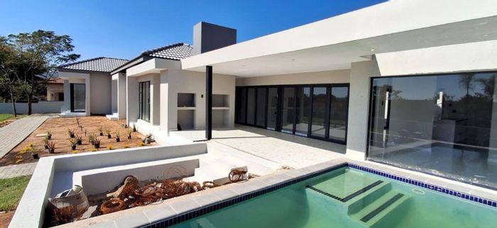 For Sale: House in Pebble Rock Golf Village with pool, golf views, and clubhouse access.