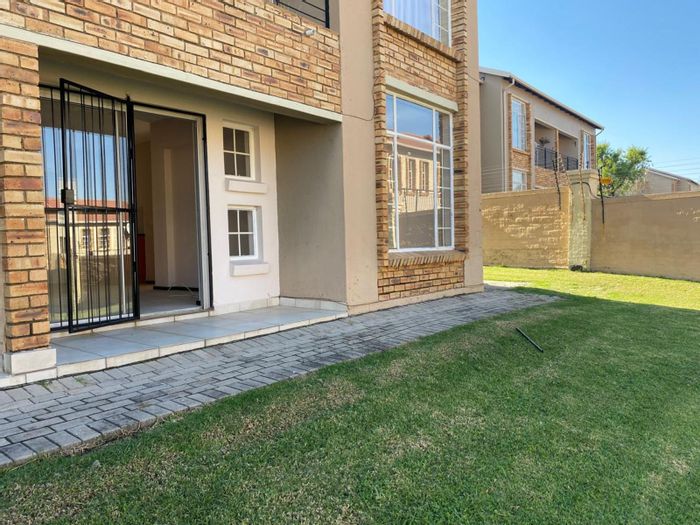 For Sale: Ground floor apartment in Laser Park with double carport and garden access.