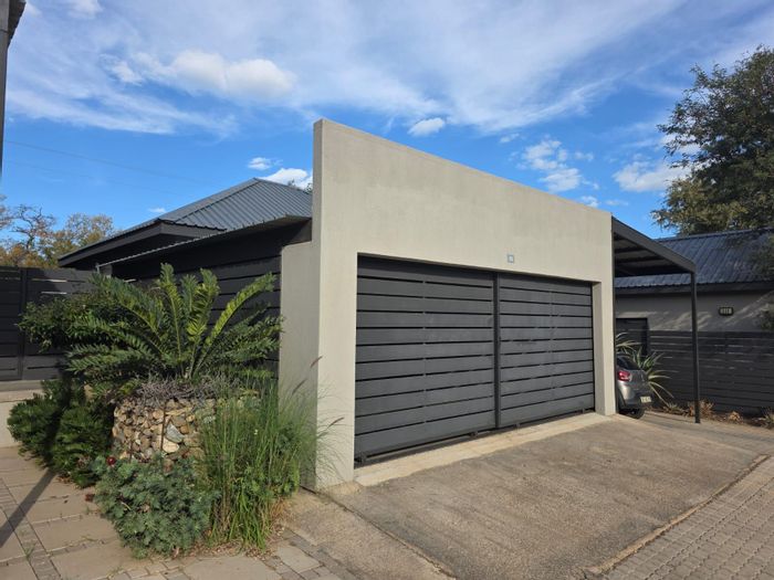 For Sale: House in Hoedspruit Central with 2 beds, secure parking, and bush views.