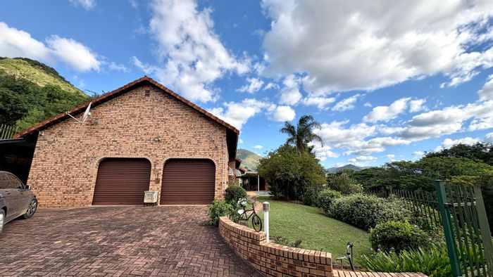 For Sale: Barberton Central house with pool, outdoor bar, secure yard, and double garage.