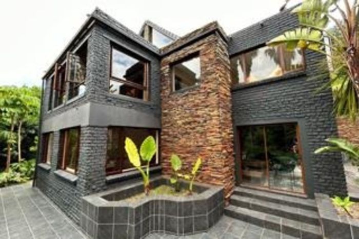 For Sale: 5-bedroom house in Fernridge with mountain views, gourmet kitchen, and landscaped grounds.