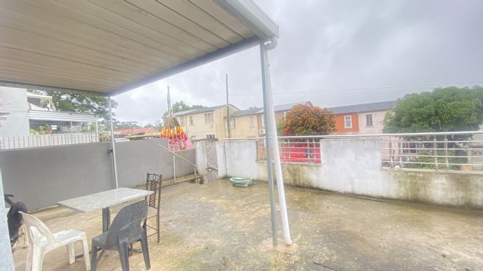 House For Sale in Grove End: 2 Bedrooms, revamped kitchen, spacious yard, parking.