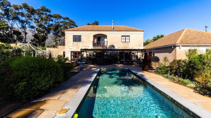 High Riding Country Estate: For Sale, House with pool, gardens, stables, and mountain views.