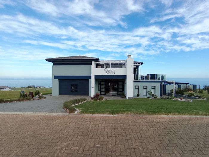 For Sale: House in Le Grand Estate with pool, dual kitchens, and secure living.