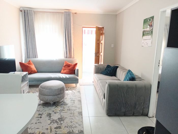 2-Bedroom Townhouse For Sale in Florida with secure parking and close amenities.
