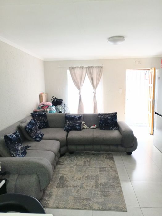 1-Bedroom Townhouse for Sale in Florida with Secure Complex and Ample Parking.