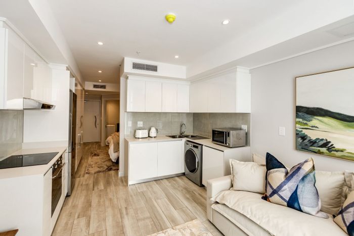 Umhlanga Central Apartment For Sale: 1 bed, ocean views, access to luxury amenities.