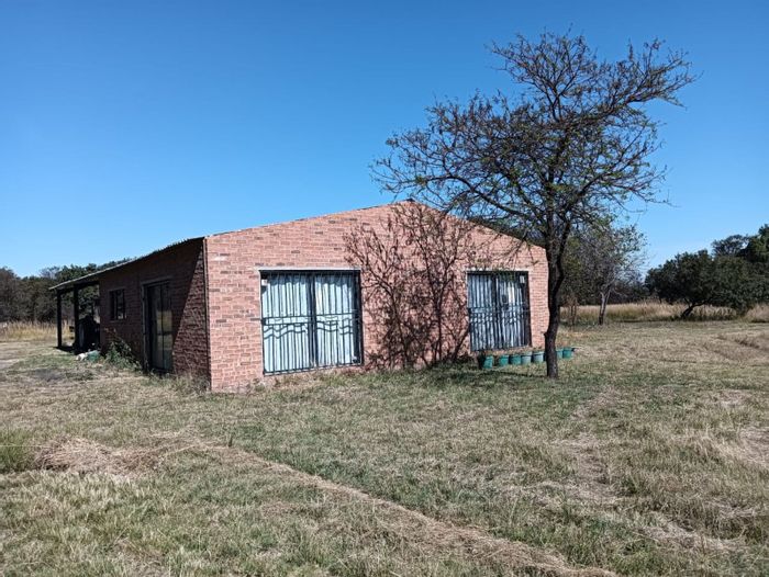 Farm for Sale in Donkerhoek AH: 4.2 hectares, borehole, approved plans, tractor included.