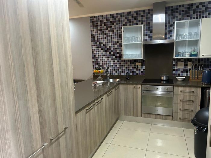 Ground floor apartment in Oaklands for sale with garden and communal pool access.