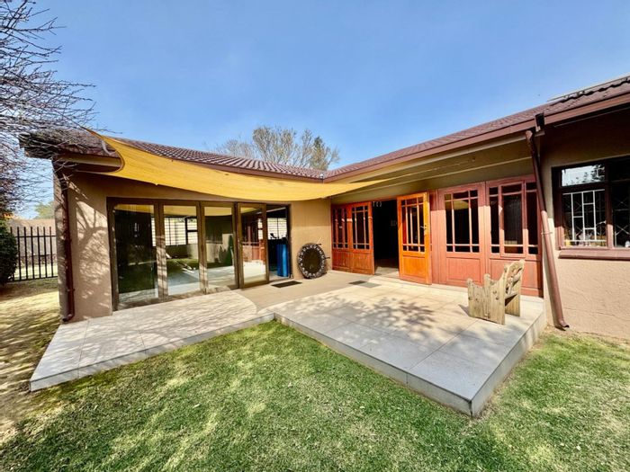 For Sale: 4-bedroom house in Secunda Central with garden, solar power, and security.