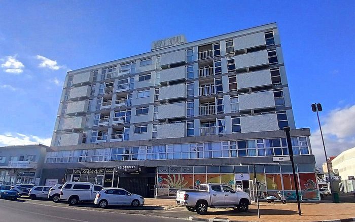 For Sale: Apartment in Strand Central with beach access, balcony, and rental potential.