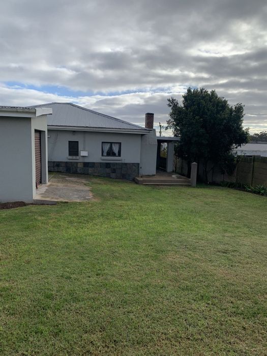 2-Bedroom House For Sale in Albertinia Central with garage, patio, and garden.