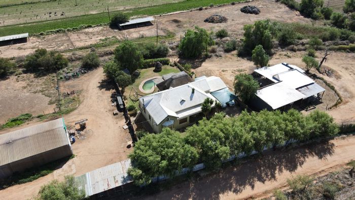 For Sale: Oudtshoorn Rural Farm with irrigation, livestock facilities, and diverse crops.