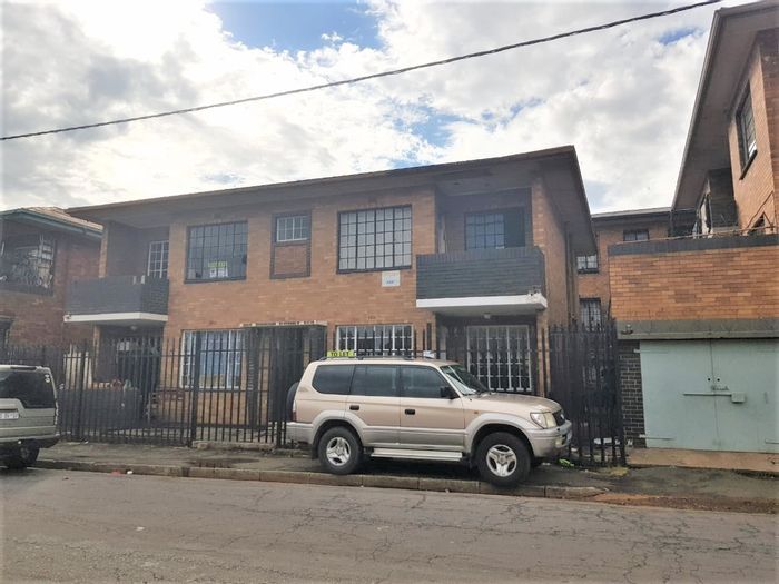 For Sale: Jeppestown Apartment, four 2-bedroom flats, income-generating, close to amenities.