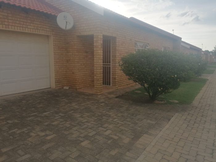 2 Bedroom Townhouse For Sale in Wilkoppies with private braai area and double garages.