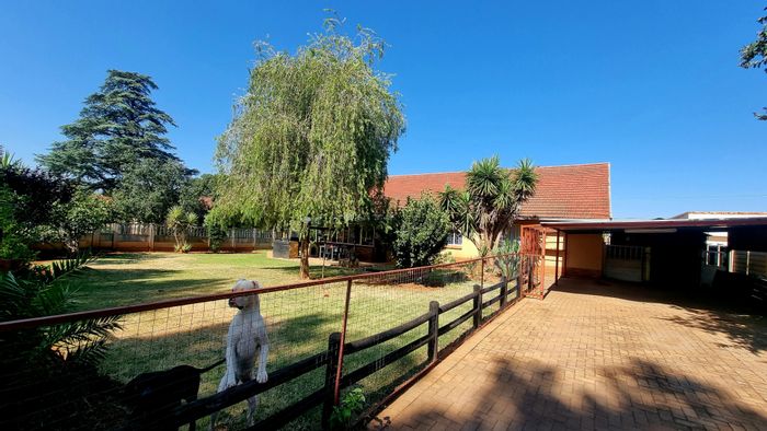 For Sale: House in Stilfontein Ext 1 with three bedrooms, braai area, and garage.