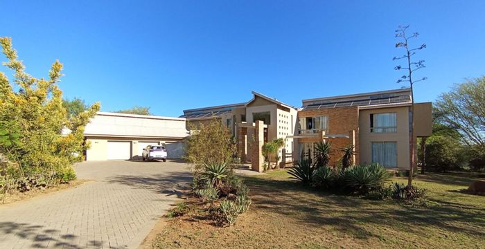 For Sale: Spacious 4-Bedroom House in Saddlebrook Estate with Pool and Garages.