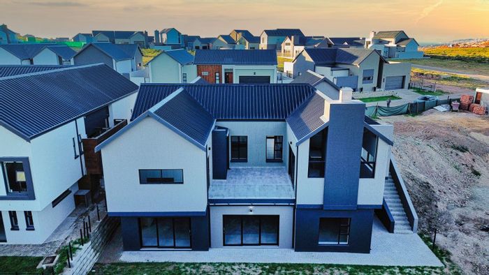 For Sale: 5-bedroom house in Outeniquasbosch, features dual lounges, braai area, and bonus room.