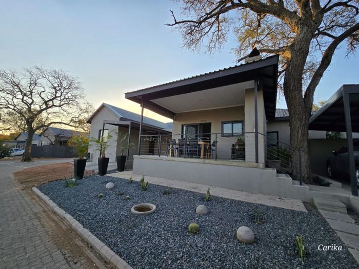 Townhouse For Sale in Hoedspruit Central: 2 beds, open-plan living, mountain views.