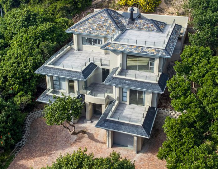 For Sale: House in Wilderness Central with 3 bedrooms, rooftop terrace, and garages.