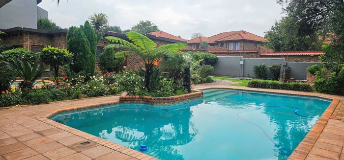 For Sale: Townhouse in Northgate with pool, play area, and balcony access.