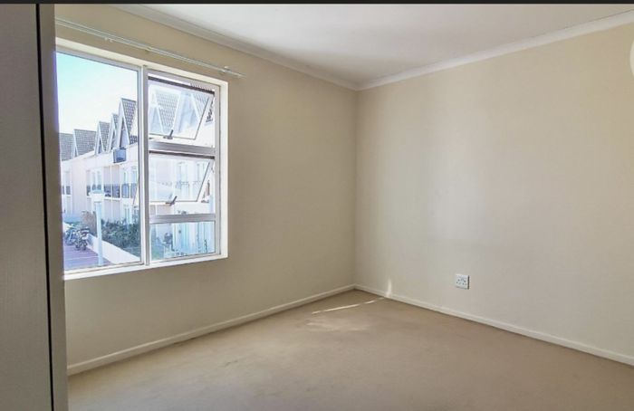 2-Bedroom Apartment For Sale in Whispering Pines with terrace, pool, and parking.