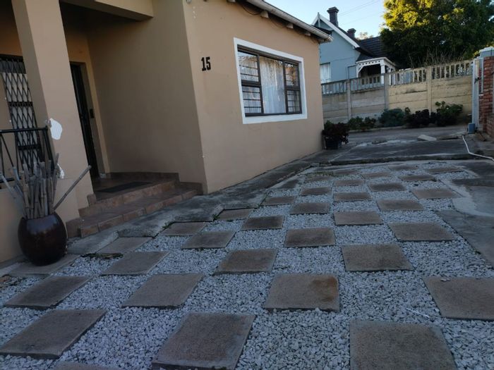 Spacious 4-bedroom house with garages, braai area, and development potential in Uitenhage Central. For Sale.