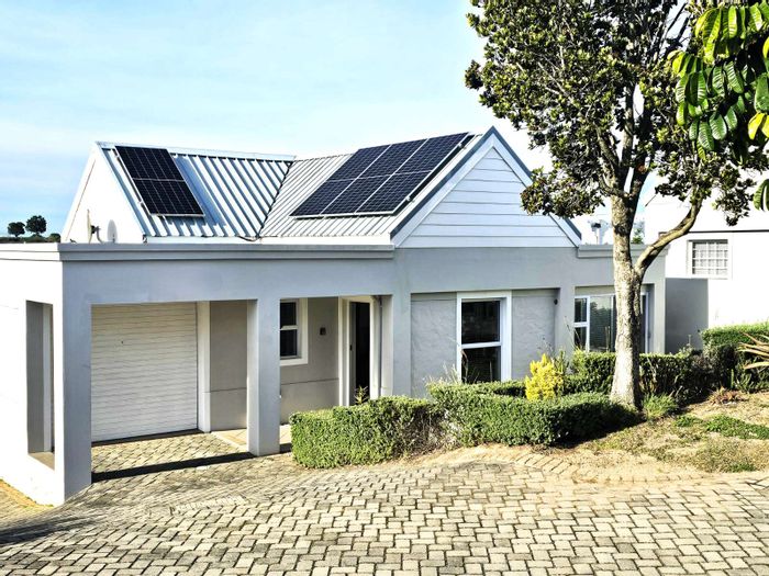 For Sale: Cluster in Kingswood Golf Estate with solar power, private garden, and garage.