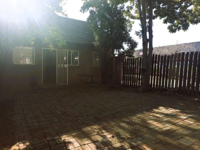 Townhouse For Sale in Brits Central: Lease in place, private garden, parking for 3.