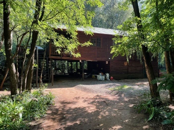 Farm for Sale in Hartzenbergfontein: Three cottages, borehole, dam, and greenhouse.