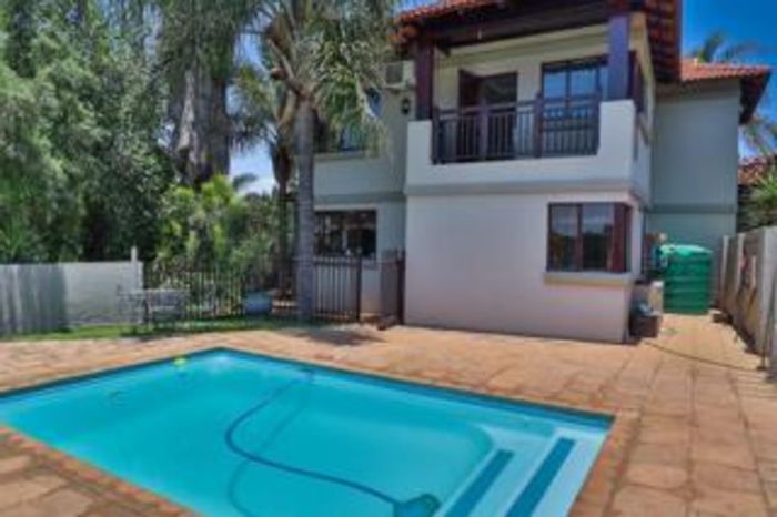 4-Bedroom House For Sale in Birdwood Estate with pool, pond, and garden.
