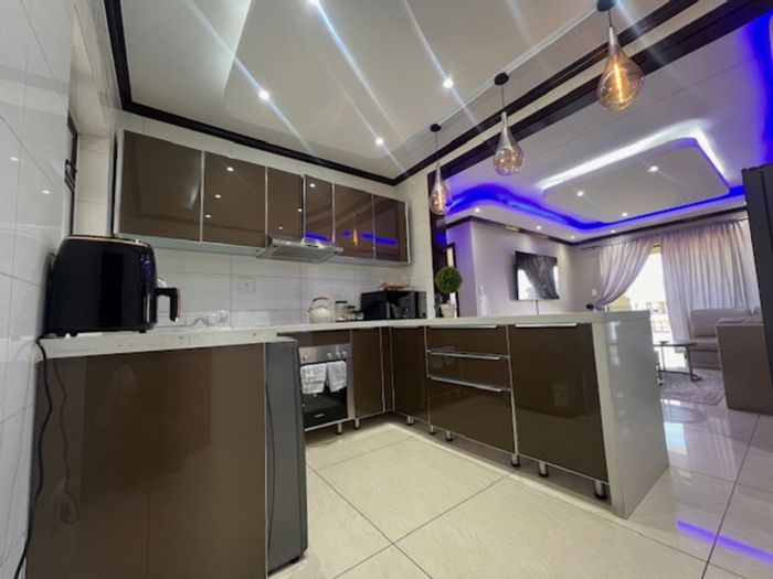 Ground floor 2-bed apartment in Craigavon with secure parking and private patio. For Sale.