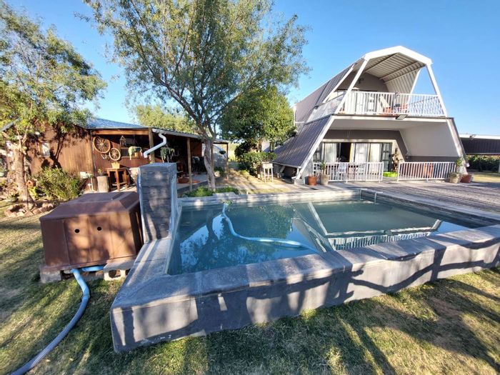 Adendorp House For Sale: Pool, spacious living, garden, studio, and self-sufficient amenities.